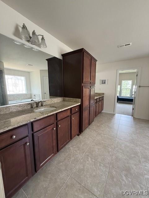 17037 Windon Ct, Moseley, VA 23120 - full bath featuring healthy amount of natural light, tile patterned flooring, and vanity