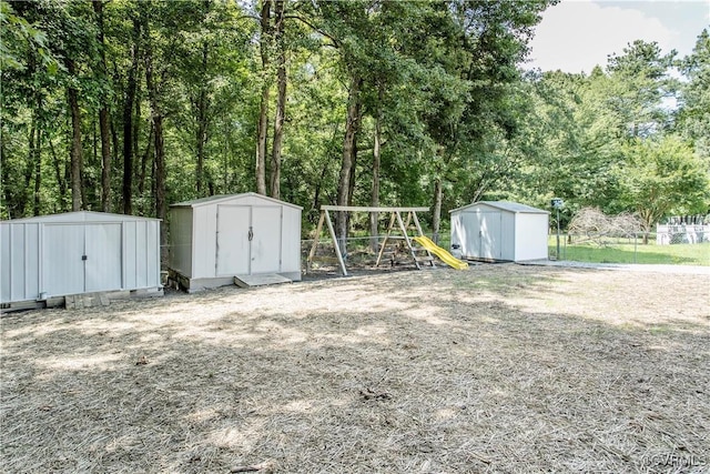 9300 Greatbridge Rd, Chesterfield, VA 23237 - view of yard featuring a storage shed and a playground