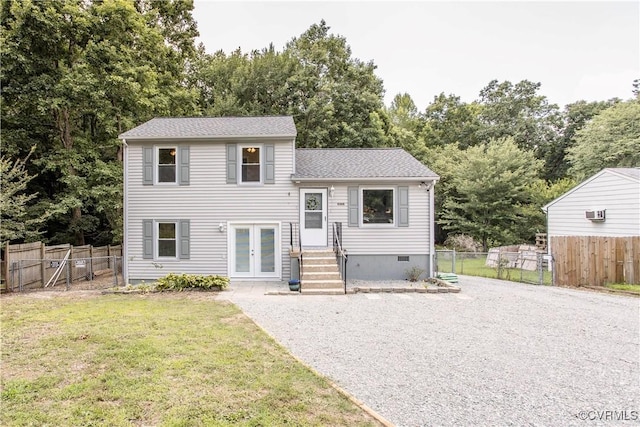 9300 Greatbridge Rd, Chesterfield, VA 23237 - tri-level home featuring french doors, view of wooded area, a shingled roof, and gravel driveway