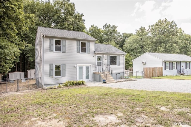 9300 Greatbridge Rd, Chesterfield, VA 23237 - split level home featuring french doors, gravel driveway, a storage shed, and view of wooded area