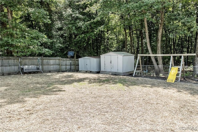9300 Greatbridge Rd, Chesterfield, VA 23237 - fenced backyard featuring a storage shed and a playground