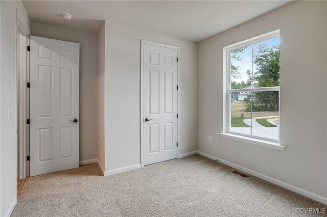 7082 Braxton Ct, Ladysmith, VA 22546 - unfurnished bedroom featuring carpet floors and baseboards