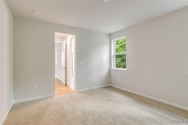 7082 Braxton Ct, Ladysmith, VA 22546 - empty room with light colored carpet and a smoke detector
