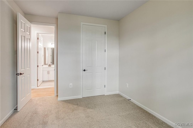 7082 Braxton Ct, Ladysmith, VA 22546 - unfurnished bedroom with light colored carpet and baseboards