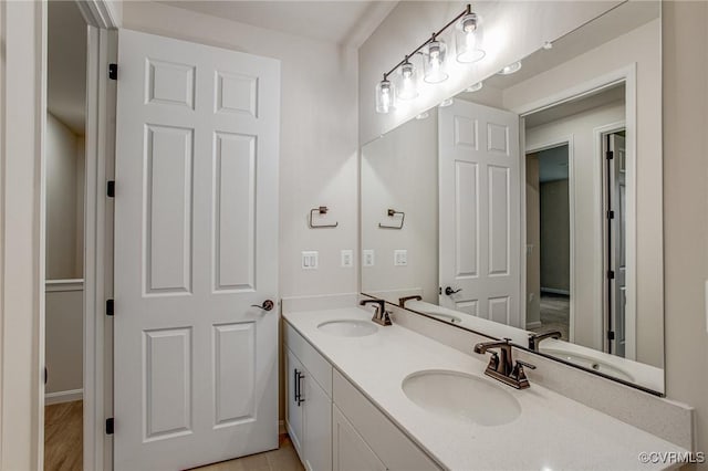 7082 Braxton Ct, Ladysmith, VA 22546 - full bathroom with double vanity and baseboards