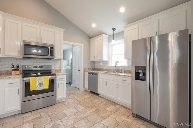 8622 Rock Cedar Rd, New Kent, VA 23124 - kitchen featuring appliances with stainless steel finishes, decorative backsplash, lofted ceiling, white cabinets, and washer / clothes dryer
