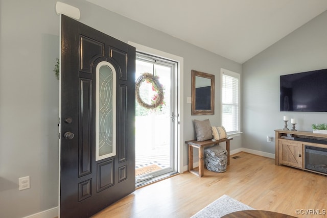 8622 Rock Cedar Rd, New Kent, VA 23124 - entryway featuring light wood-style floors and vaulted ceiling