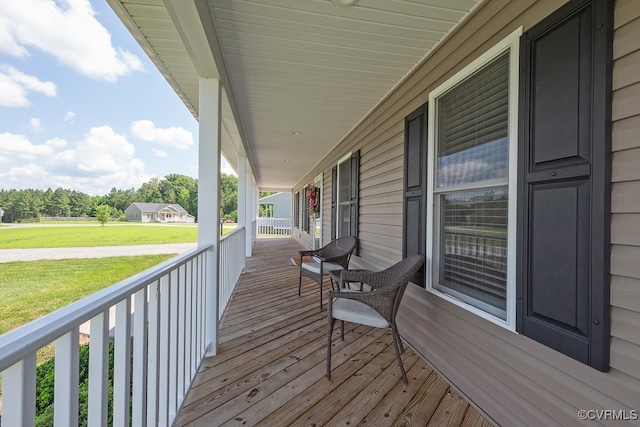 8622 Rock Cedar Rd, New Kent, VA 23124 - wooden porch featuring a yard