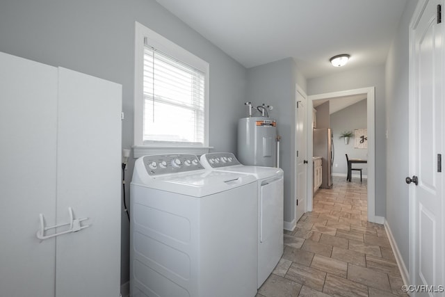 8622 Rock Cedar Rd, New Kent, VA 23124 - washroom featuring washer and clothes dryer, stone finish floors, and water heater