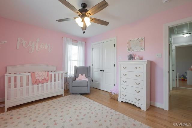 8622 Rock Cedar Rd, New Kent, VA 23124 - bedroom with attic access, wood finished floors, a closet, a crib, and a ceiling fan