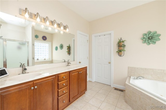 4837 Glenmorgan Ct, Chester, VA 23831 - bathroom featuring a stall shower, a garden tub, tile patterned flooring, and double vanity
