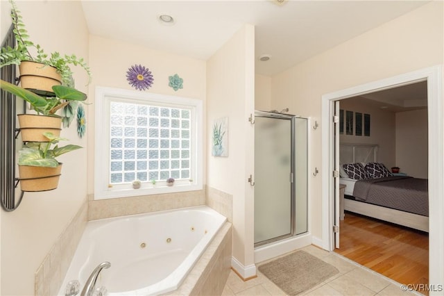 4837 Glenmorgan Ct, Chester, VA 23831 - ensuite bathroom featuring a shower stall, a tub with jets, and tile patterned floors