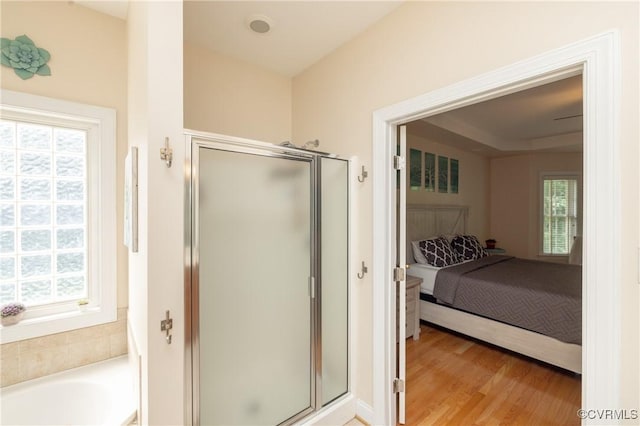 4837 Glenmorgan Ct, Chester, VA 23831 - full bathroom featuring connected bathroom, a shower stall, wood finished floors, and a garden tub