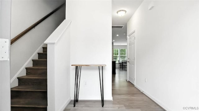 7750 Leeds Castle Ln, New Kent, VA 23124 - stairs with wood finished floors and baseboards