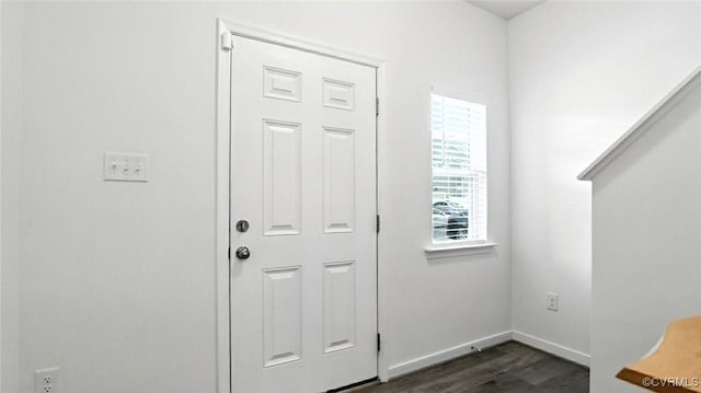 7750 Leeds Castle Ln, New Kent, VA 23124 - doorway to outside with dark wood-type flooring and baseboards