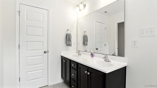 7750 Leeds Castle Ln, New Kent, VA 23124 - full bathroom with double vanity and tile patterned floors