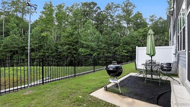 7750 Leeds Castle Ln, New Kent, VA 23124 - fenced backyard featuring a patio
