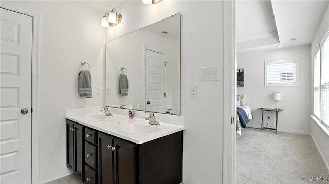 7750 Leeds Castle Ln, New Kent, VA 23124 - full bath with double vanity, healthy amount of natural light, and connected bathroom