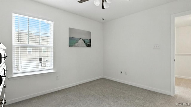 7750 Leeds Castle Ln, New Kent, VA 23124 - unfurnished bedroom featuring carpet, multiple windows, and a ceiling fan