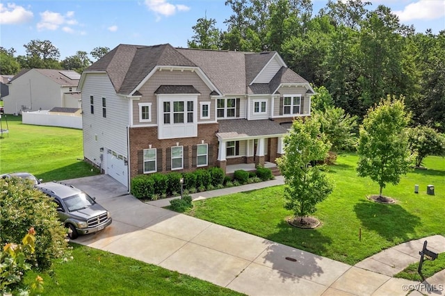 10485 Eagle Ct, Prince George, VA 23860 - view of front facade with driveway, brick siding, a garage, a front yard, and roof with shingles