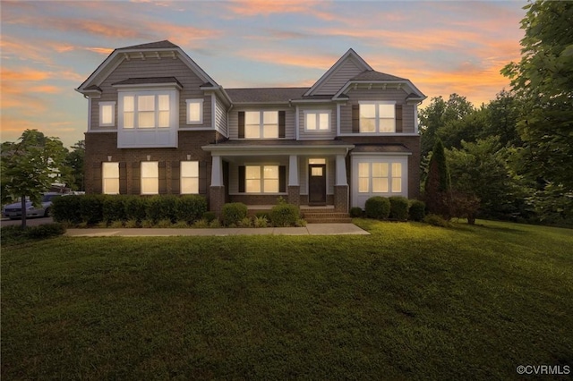 10485 Eagle Ct, Prince George, VA 23860 - view of front of home featuring a yard, brick siding, and covered porch