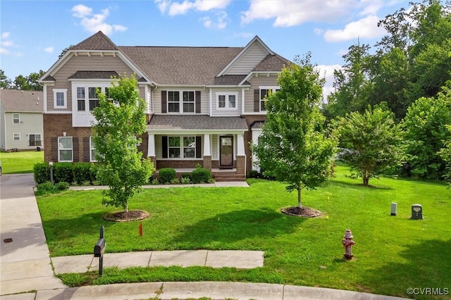 10485 Eagle Ct, Prince George, VA 23860 - craftsman-style home with brick siding, a front lawn, and roof with shingles