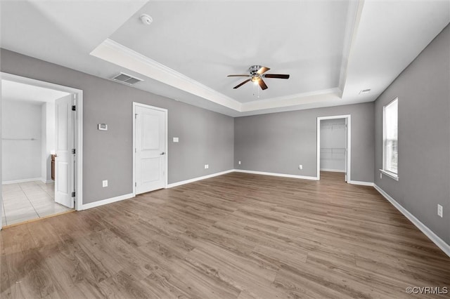 10485 Eagle Ct, Prince George, VA 23860 - empty room with a raised ceiling, a ceiling fan, a smoke detector, wood finished floors, and ornamental molding
