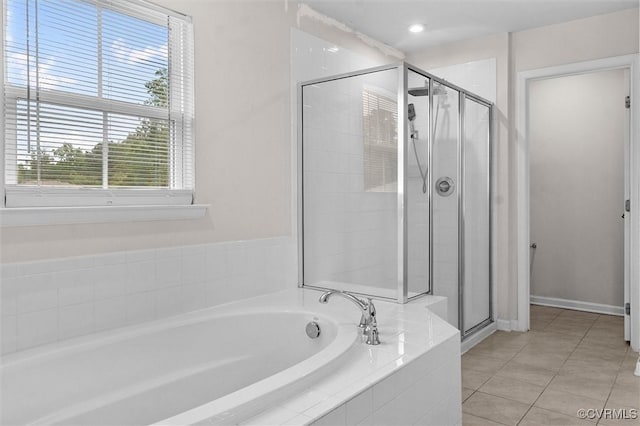 10485 Eagle Ct, Prince George, VA 23860 - bathroom featuring a garden tub, a stall shower, and tile patterned floors