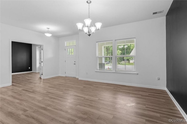 10485 Eagle Ct, Prince George, VA 23860 - unfurnished living room with a chandelier and wood finished floors