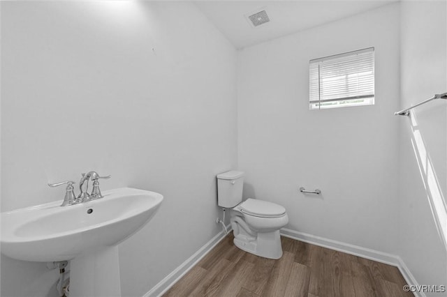 10485 Eagle Ct, Prince George, VA 23860 - bathroom featuring a sink and wood finished floors
