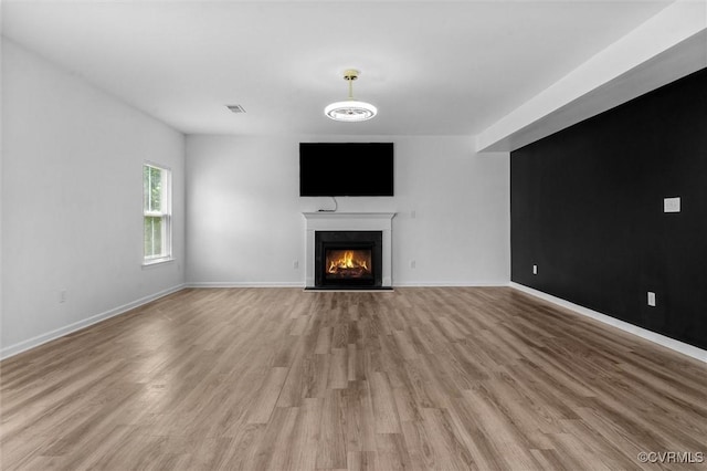 10485 Eagle Ct, Prince George, VA 23860 - unfurnished living room with a fireplace with flush hearth and light wood-style flooring
