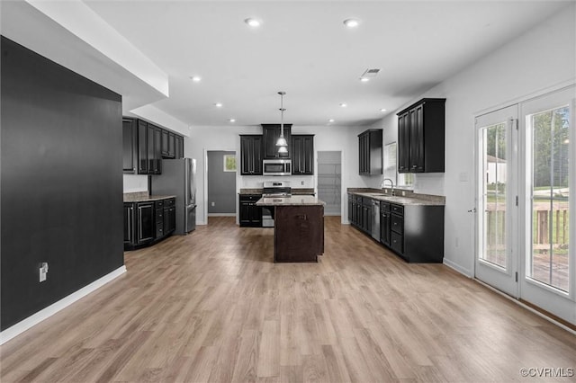 10485 Eagle Ct, Prince George, VA 23860 - kitchen featuring appliances with stainless steel finishes, dark cabinetry, and recessed lighting