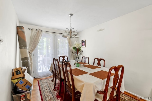 5564 Heatherhill Dr, North Chesterfield, VA 23234 - dining area with a chandelier and wood finished floors