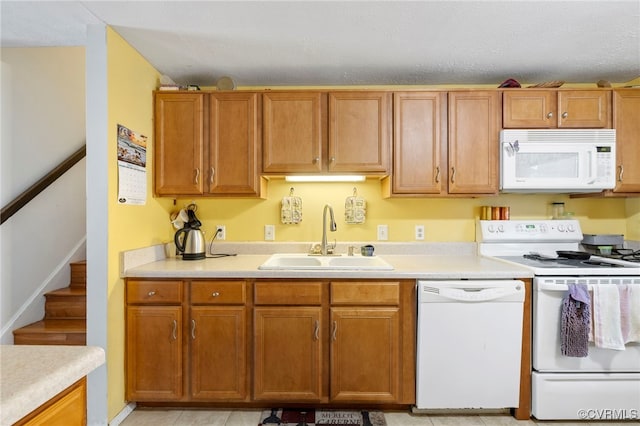 5564 Heatherhill Dr, North Chesterfield, VA 23234 - kitchen featuring white appliances, light countertops, brown cabinets, and a textured ceiling