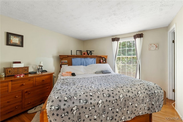 5564 Heatherhill Dr, North Chesterfield, VA 23234 - bedroom featuring wood finished floors and a textured ceiling