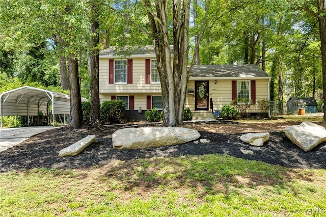 5564 Heatherhill Dr, North Chesterfield, VA 23234 - split level home featuring a carport, a chimney, concrete driveway, and view of wooded area