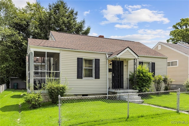 125 Seaboard St, Petersburg, VA 23803 - view of front of house with a fenced front yard, a sunroom, roof with shingles, and a chimney