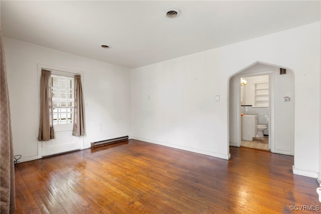 125 Seaboard St, Petersburg, VA 23803 - unfurnished room with arched walkways, wood-type flooring, and a baseboard heating unit