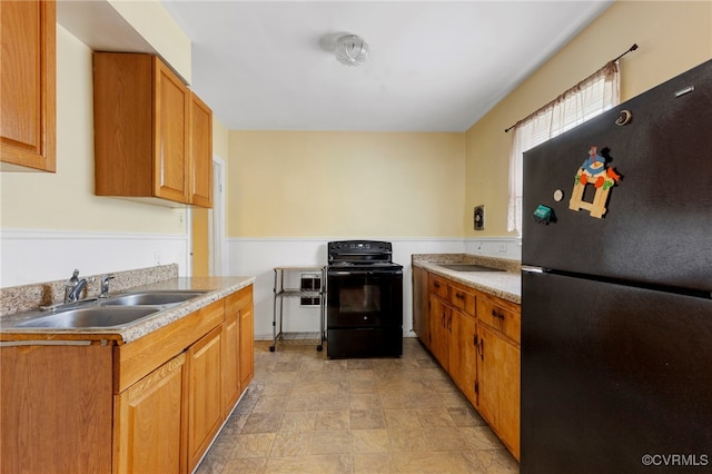 125 Seaboard St, Petersburg, VA 23803 - kitchen with black appliances, light countertops, and brown cabinets