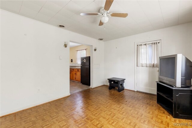 125 Seaboard St, Petersburg, VA 23803 - unfurnished living room featuring a ceiling fan and baseboards