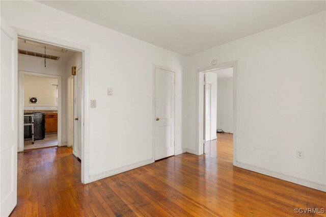 125 Seaboard St, Petersburg, VA 23803 - spare room featuring attic access and dark wood finished floors