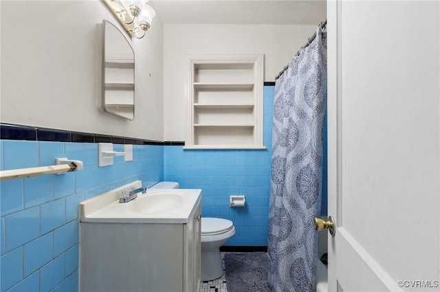 125 Seaboard St, Petersburg, VA 23803 - bathroom with tile walls, vanity, a shower with curtain, wainscoting, and tile patterned flooring
