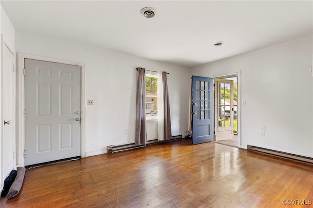 125 Seaboard St, Petersburg, VA 23803 - foyer entrance with wood finished floors, a baseboard heating unit, and a baseboard radiator