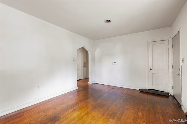 125 Seaboard St, Petersburg, VA 23803 - empty room with arched walkways and hardwood / wood-style flooring