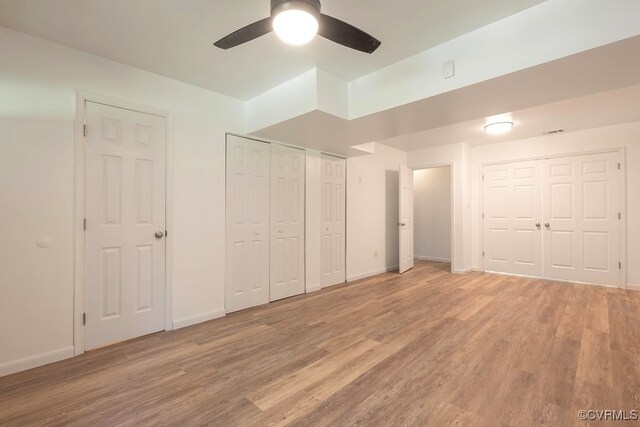 5636 Charter Oak Dr, Chesterfield, VA 23832 - unfurnished bedroom featuring multiple closets, light wood-style flooring, and a ceiling fan
