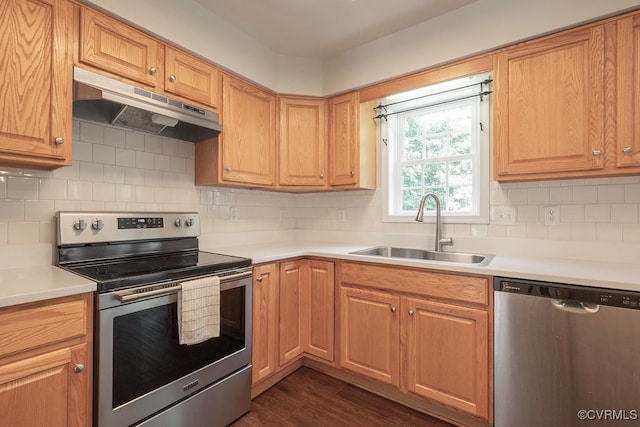5636 Charter Oak Dr, Chesterfield, VA 23832 - kitchen featuring stainless steel appliances, under cabinet range hood, light countertops, dark wood finished floors, and backsplash