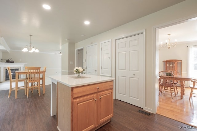 5636 Charter Oak Dr, Chesterfield, VA 23832 - kitchen featuring a chandelier, dark wood finished floors, light countertops, a kitchen island, and decorative light fixtures