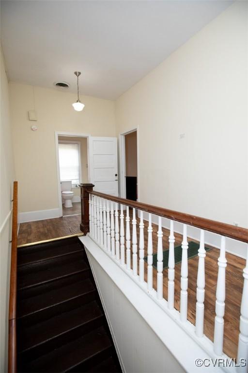 410 E 2nd St, Farmville, VA 23901 - stairs featuring wood finished floors and baseboards