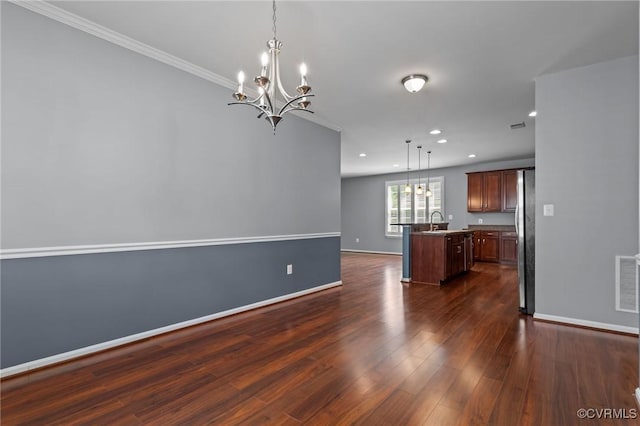 8334 E Lord Botetourt Loop, New Kent, VA 23124 - kitchen with a center island with sink, a chandelier, open floor plan, freestanding refrigerator, and dark wood-type flooring