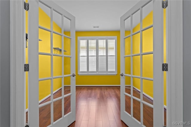 8334 E Lord Botetourt Loop, New Kent, VA 23124 - hallway featuring wood finished floors